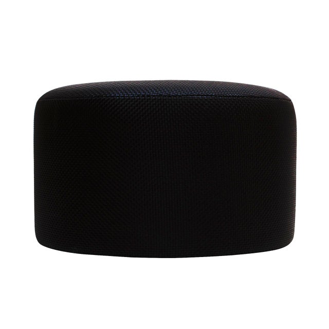 Contemporary pouf with wooden structure upholstered in black braided lambskin. Design by la studio. this contemporary pouf...
