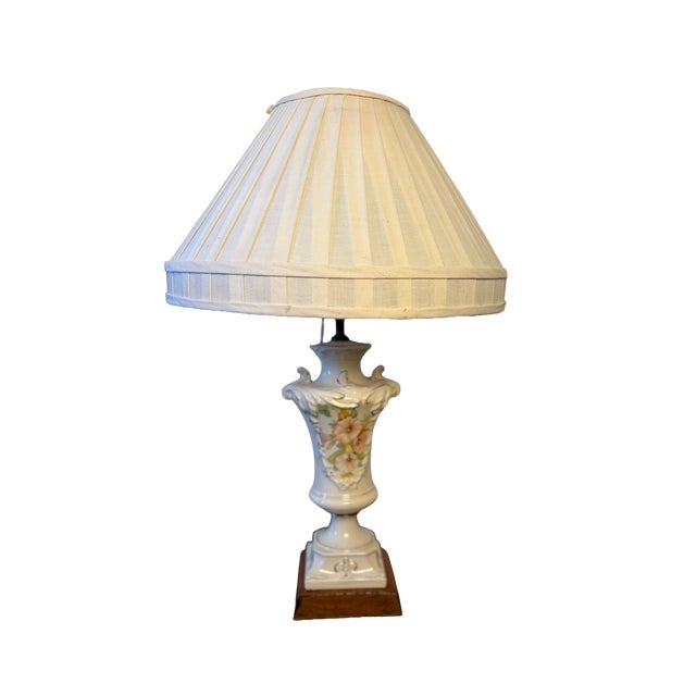 Charming vintage porcelain table lamp featuring an elegant urn-shaped body adorned with delicate pink, peach, and green...