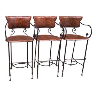 Arhaus Wrought Iron & Leather Hide Cafe Collection Bar Stools - Set of 3 For Sale