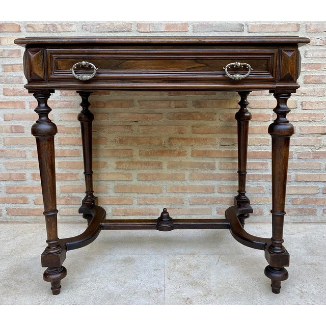 Louis XVI style oak side table with a large drawer with bronze handles, round legs at each corner joined with a beautiful...