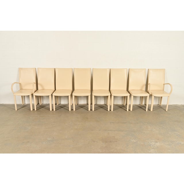 A sleek and stylish set of eight Italian Modern or Postmodern high back dining chairs In the manner of Mario Bellini for...