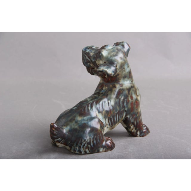 Terrier model 20129, designed by Knud Kyhn for Royal Copenhagen. Made of stoneware with sung glaze. A beautiful 1st class...