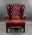 A good quality ox blood red leather wing back armchair, remaining in very good condition for its age. Width: 98cm Depth:...