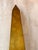 Tall tapered brass obelisk with raised ball accents and a stepped architectural base. The original Made in Hong Kong label...