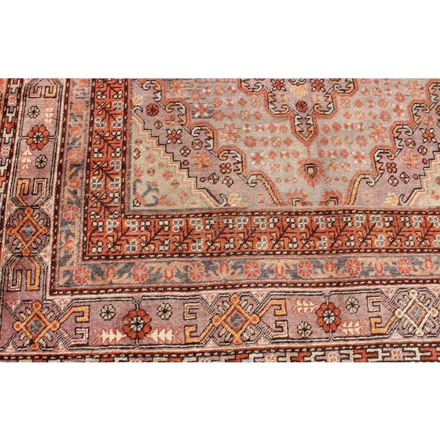 Early 20th Century Antique Khotan Rug With Medallion Design in Muted Blue, Rust, and Soft Beige 6'6"x13'0" For Sale - Image 5 of 7