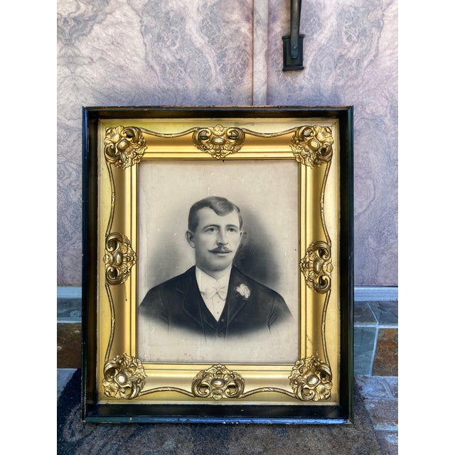 Nice antique portrait of a dapper gent in a gorgeous antique gold frame. The frame is mounted inside a protective box...