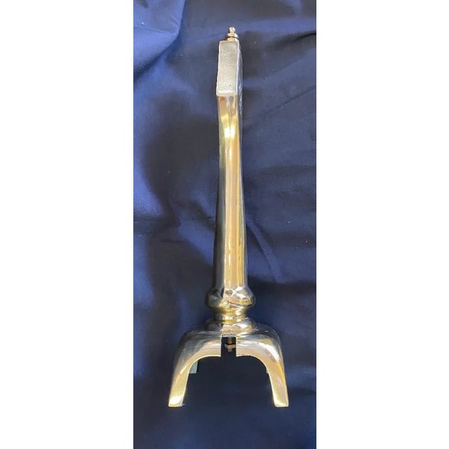 Art deco style brass chenets. Lacquered 5 inch square base. Originally would of had a brass rod between them making them...