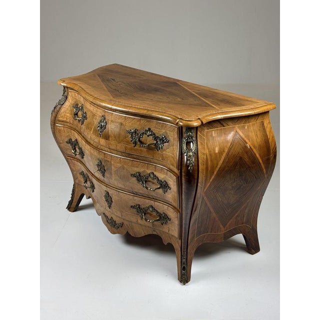 This 18th-century Swedish marquetry chest of drawers is beautifully inlaid with various woods. The base is made of heavy...