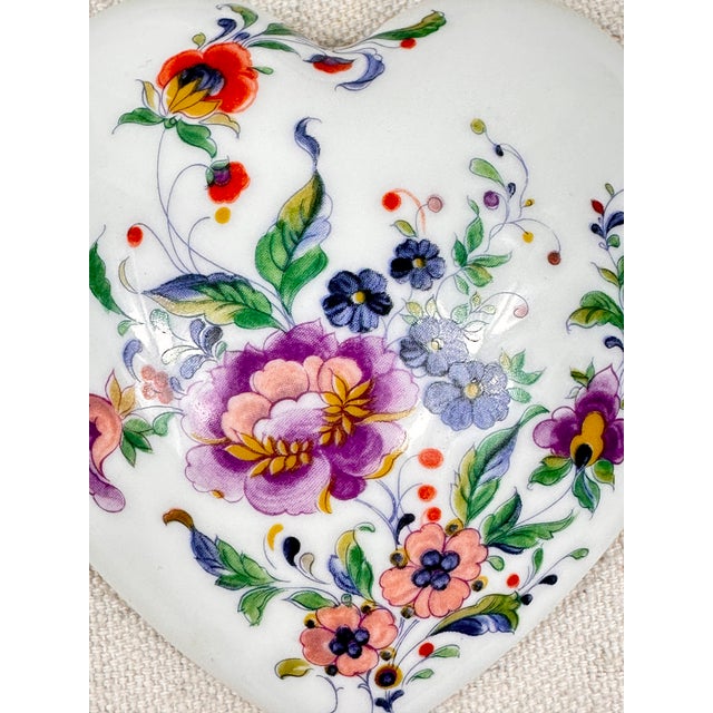 Vintage Limoges porcelain box. Shaped in a heart shape, with floral design. Perfect for small jewelry or desk accessories....