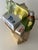 This is a vintage 1976 E.S. Molds ceramic canister designed to look like a brown grocery paper bag filled with food...