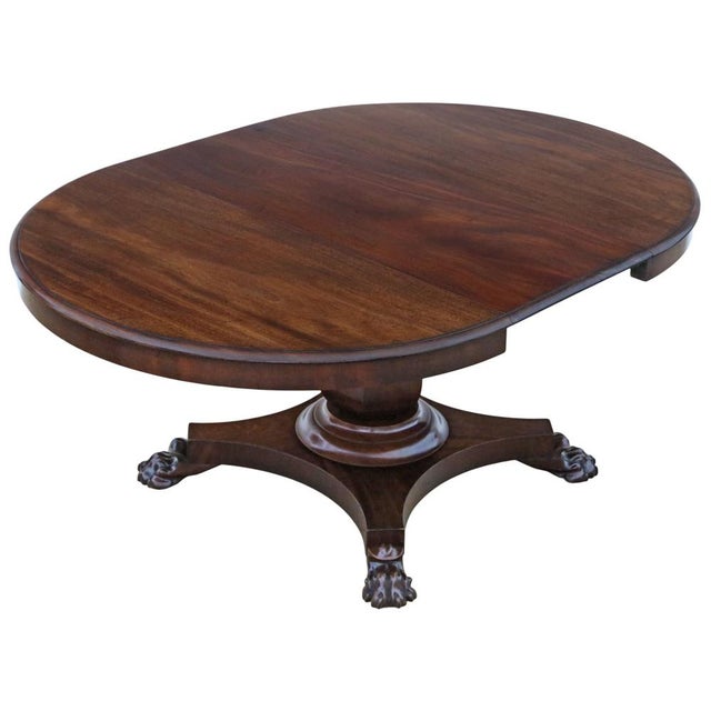 This 19th-century mahogany dining table emits charm, character, and a wonderful stylishness. A rare and decorative find,...