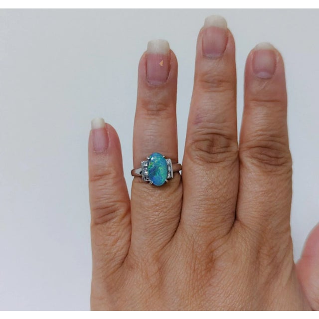 Beautiful 2.55 ct. black opal oval with 0.64 ct. good quality white diamond squares. Handmade in platinum. Ring size 5.5....