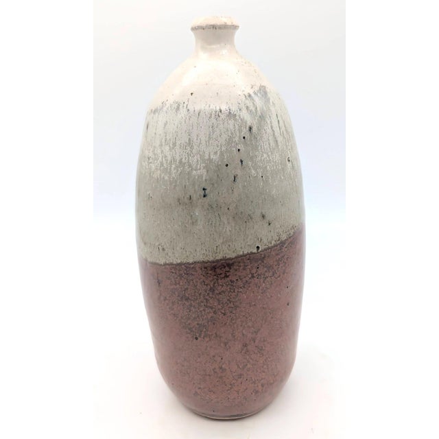 Offered is a vintage, circa. 1960s - 1970s handmade vase with a wood ash glaze handcrafted from stoneware clay.and sealed...