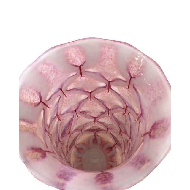 Vases in transparent ruby ​​with canes in relief and thus arranged in lozenge (diamond-shaped patterns). Vase attributed...