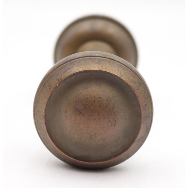 Vintage concentric passage door knobs made of brass with a muted patina finish. Priced as a pair of knobs with a spindle....
