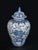 A classic interpretation of the timeless Blue Delft style, this lidded ceramic urn features intricate hand-painted...