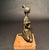 An elegant and expressive mid-century modern bronze sculpture by Italian artist Frido Graziani depicting a seated female...