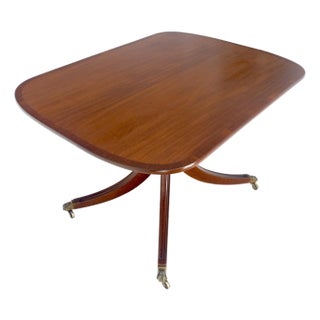 Tilt Top Banded Mahogany Carved Base on Brass Wheels Dining Breakfast Table For Sale
