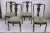 Group of four oak chairs with arched backrest and carved on the high central part, upholstered seat and worked and armed...