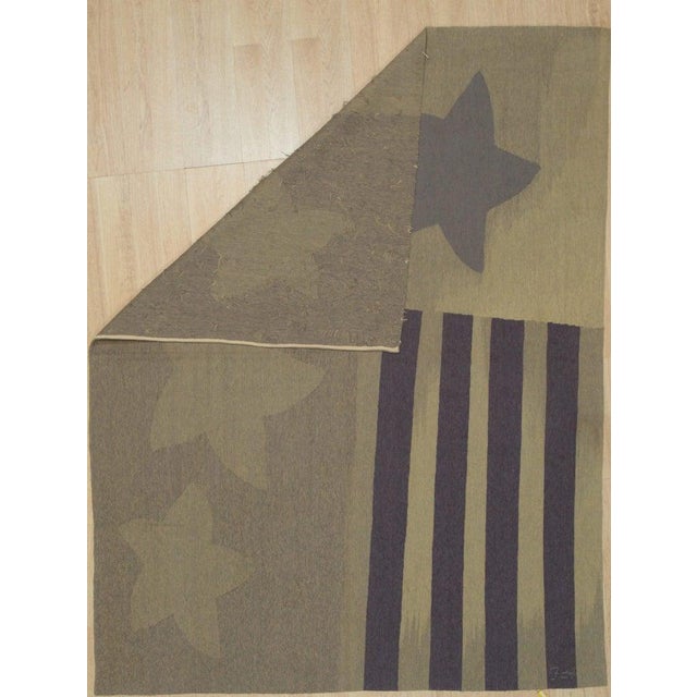 This gray flat weave rug is crafted from wool in the traditional Kilim style. Produced in China, the rug features a medium...