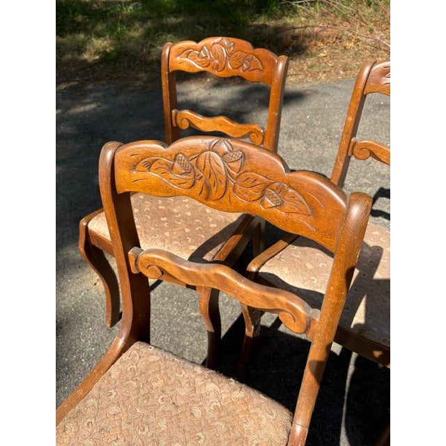 Set of four Tell City dining chairs. Excellent solid condition with original finish. c.1940's. Distinctive acorn and leaf...