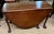 I believe from the research I've done that this is a rare Gateleg table made by Kittinger CW74 for Colonial Williamsburg....