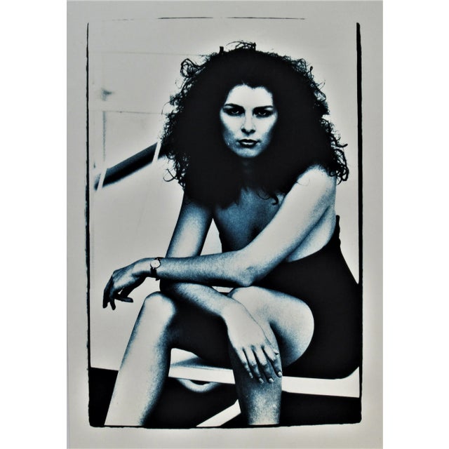 This photograph "Young Woman Sitting" c.1980 is an original gelatin silver print by famous German photographer and artist...