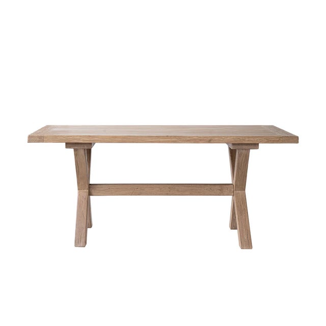 Crafted from reclaimed elm, this dining table features a substantial rectangular top supported by a classic X-frame...