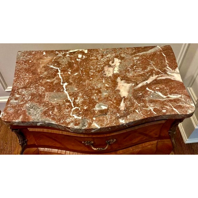 For sale is an exquisite mid-20th-century Louis XV style rosewood bombé chest featuring exceptional craftsmanship and...