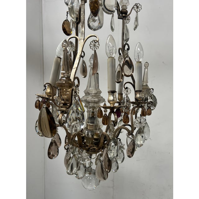 Louis XV style cage chandelier with faceted, colorful pendants The frame is silvered bronze The chandelier has nine lights...