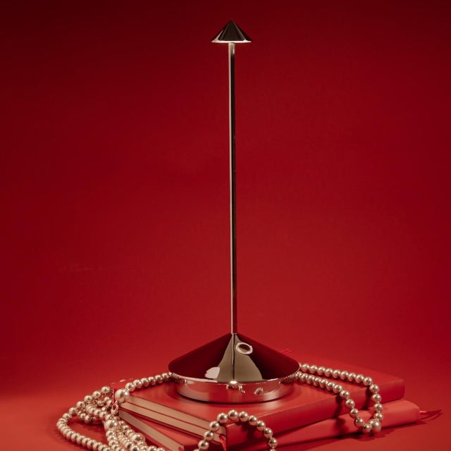 Pina Pro Battery-operated and rechargeable portable table lamp. The lamp features dimming touch control and has 3-CCT...