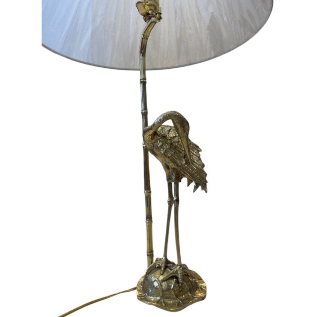 Add a sophisticated touch of coastal elegance to your home with this vintage Hollywood Regency brass table lamp. Featuring...