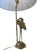 Add a sophisticated touch of coastal elegance to your home with this vintage Hollywood Regency brass table lamp. Featuring...
