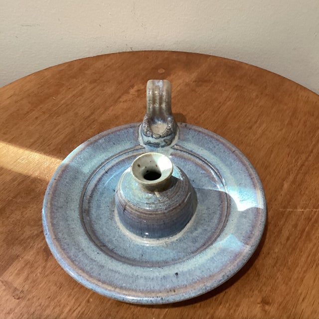 This vintage studio pottery stoneware glazed candle holder with an attached drip plate is a unique and handmade piece of...