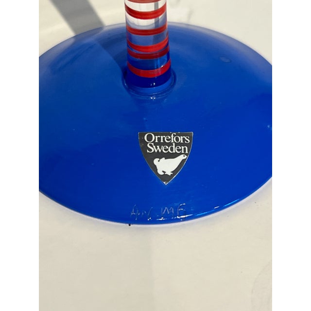 A whimsical fluted champagne crystal glass by Anne Nilsson which she called "CLOWN". She designed the flute for Orrefors,...