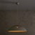 This 1970s pendant, attributed to Pruluce Vicenza, distills industrial design into a form of poetic simplicity. The wide...