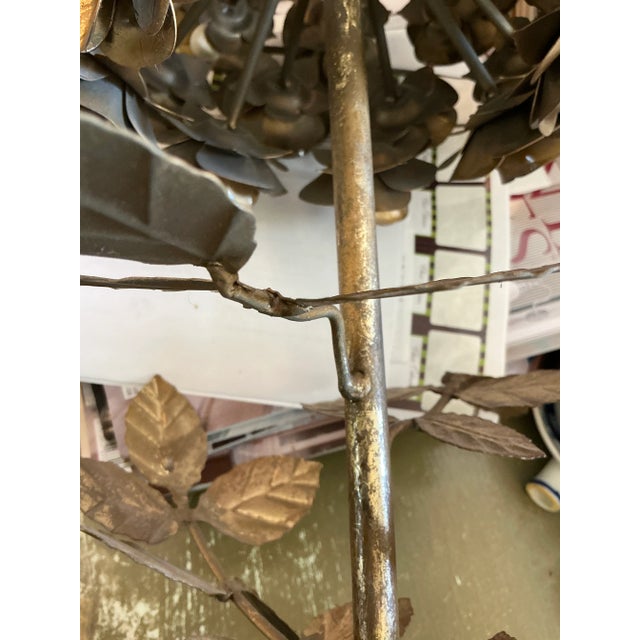 Impressive pair of large metal rose topiaries. Lovely burnished gold rose trees mounted in weighted tole pots. Dramatic...