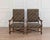 A refined pair of French armchairs crafted in solid walnut, dating to the turn of the 20th century. These chairs feature...