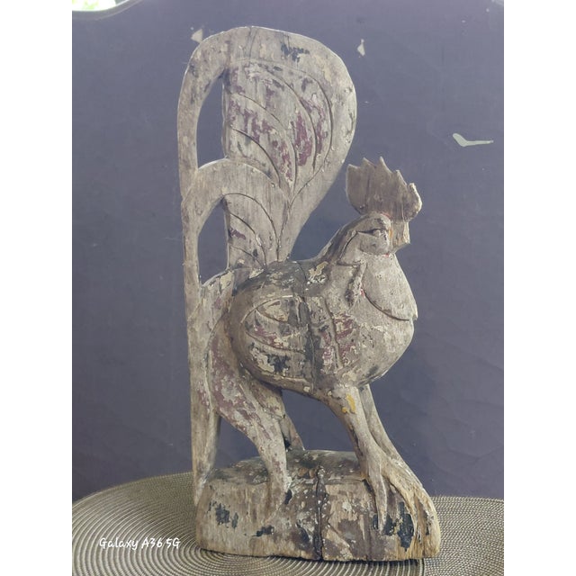 DESCRIPTION: A striking, highly characterful early-to-mid 20th-century folk art rooster sculpture, masterfully hand-carved...