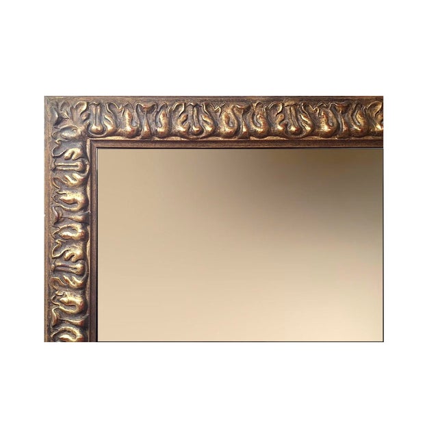 You can almost see this 20th-century, carved gilt wood mirror reflecting a gathering of well-coiffed socialites, cocktails...