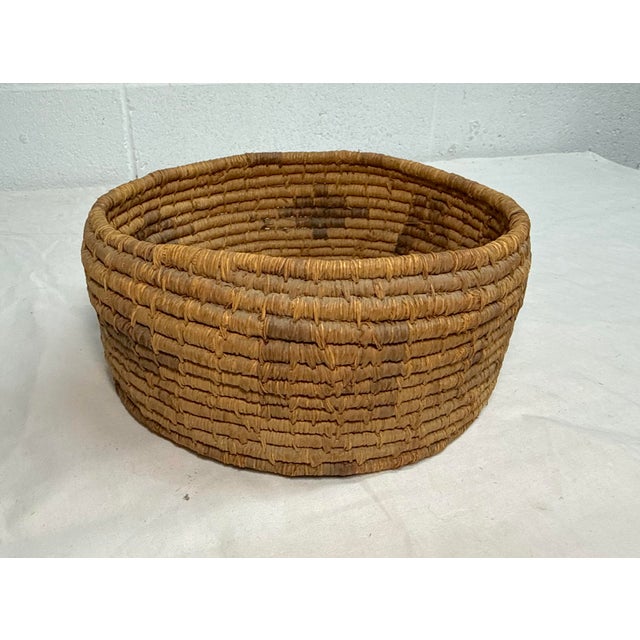 This rare antique 19th century Native American hand-woven polychromed basket is a true treasure for collectors and...