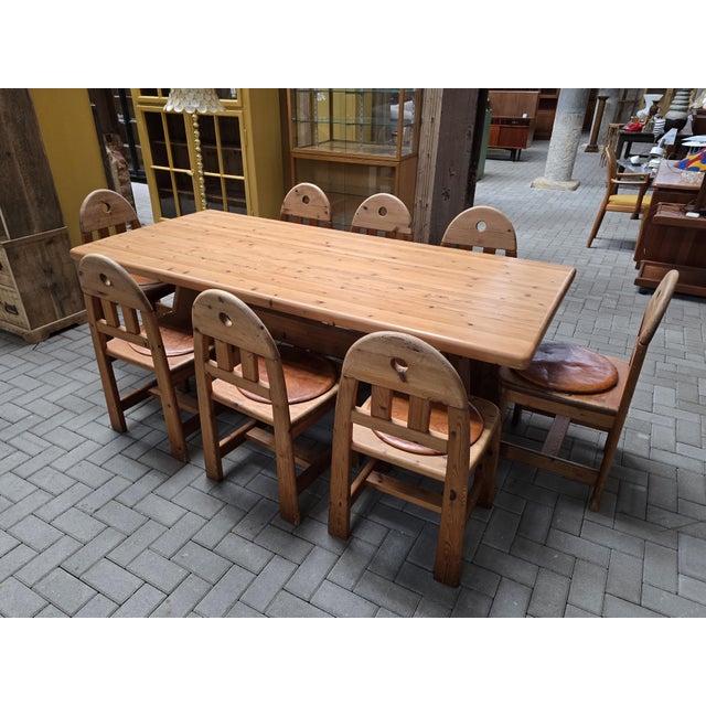 Solid pine dining table set consisting of eight sturdy chairs and one large dining table. The set is extremely well...