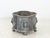 This 1850s antique English lead planter or cachepot features a quatrefoil form with lion-head reliefs and lion-paw feet...