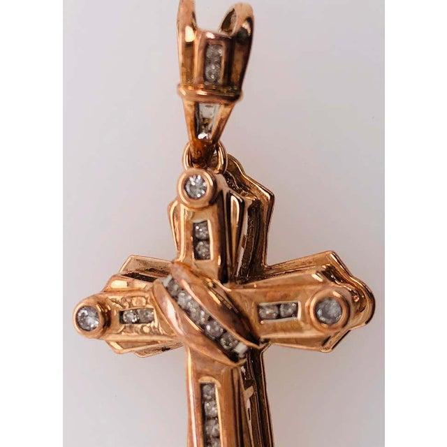14Kt Yellow Gold Crucifix Cross Pendant with .50 Total Diamond Weight. 46.23mm Long. 23mm side and 9 mm thick. 4.46 grams...
