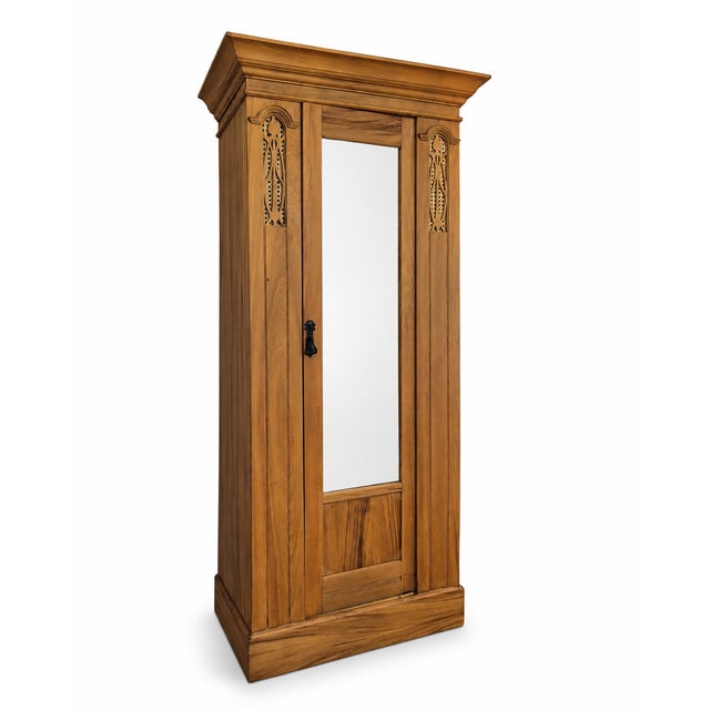 A beautifully restored antique solid satin walnut single wardrobe, combining useful hanging storage with elegant period...