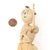 This Handmade corn husk mother and child from Zimbabwe depicts a working mother carrying her child and a load of wood....