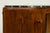 1930s French Art Deco walnut sideboard, sourced in Provence, France. The piece features a broad, gently shaped façade with...