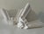 Original Streamline Moderne plaster sconces reduced to pure geometry. Fluted verticals resolve into a rhythmic triple-wave...