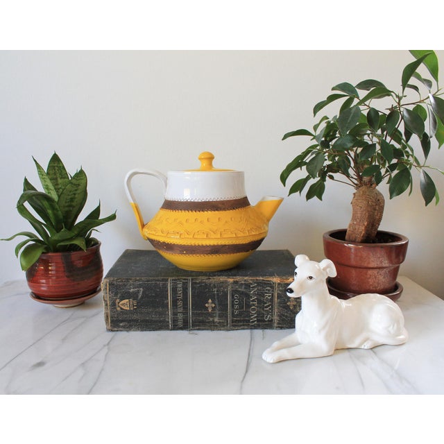 Mid-century modern tea or coffee pot. Made in Italy. Some small chips. Pictured.