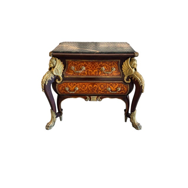 An elegant mid-20th century French Louis XIV style bombe commode, richly crafted in walnut and adorned with intricate...